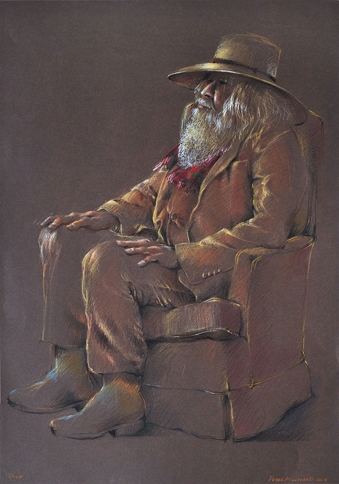 Portrait of seated man in a suit.