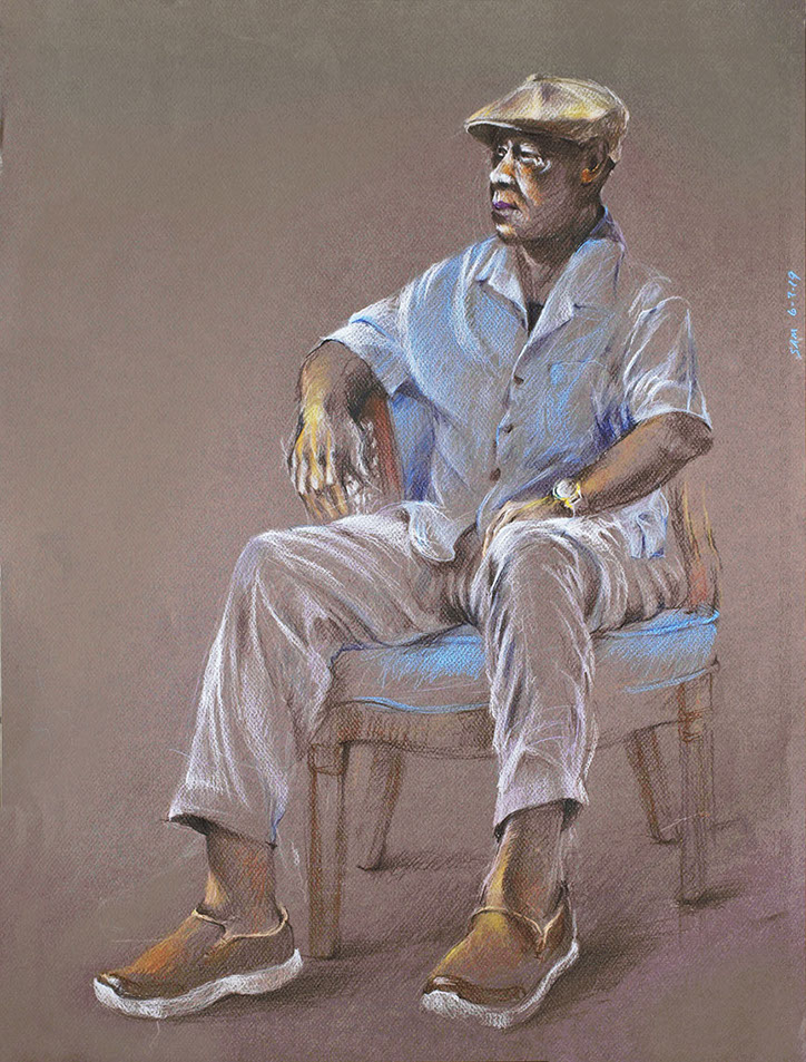 Portrait of seated older man in a soft hat and summer clothes.